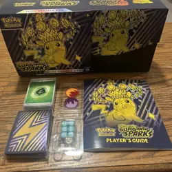 Surging Sparks ETB Empty No Packs, Energy Cards, Dice, Coins, Guide, Sleeves - Image 1