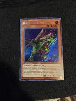 YUGIOH Secret Rare B-Buster Drake LCKC-EN020 1st Edition - Image 1