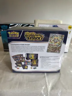 POKEMON SURGING SPARKS FACTORY SEALED ETB - Image 4