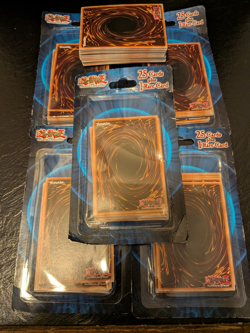5 Yu-gi-oh Packs of 25 cards plus 1 rare card 2016 5 Sealed Packs plus 52 loose - Image 1