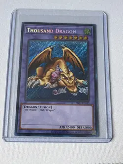 YUGIOH THOUSAND DRAGON MRD-EN143 SECRET UNLIMITED ED LP 2020 BLEED HOLO - Image 1