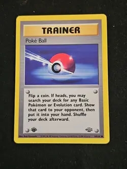Pokemon TCG Jungle Poke Ball 64/64 1st Edition Regular Trainer - Image 1