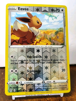POKEMON EEVEE 125/203 REVERSE HOLO EVOLVING SKIES MP RAYQUAZA IN BACKGROUND - Image 1