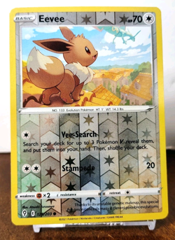 POKEMON EEVEE 125/203 REVERSE HOLO EVOLVING SKIES MP RAYQUAZA IN BACKGROUND - Image 1