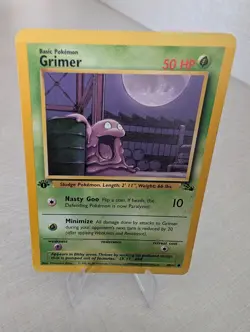 Pokemon TCG Grimer 1st Edition Common Card Fossil 48/62, NM/LP Condition - Image 1