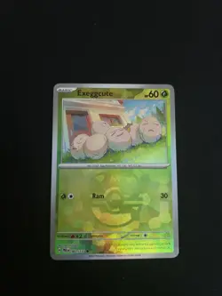 Exeggcute (Master Ball) 001/131 SV: Prismatic Evolutions Holo Pokemon Card - Image 1