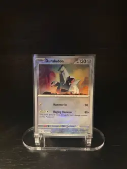 DURALUDON (MASTER BALL PATTERN) 069/131 HOLO PRISMATIC EVOLUTIONS POKEMON NM/M - Image 1
