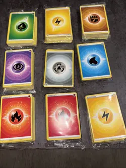Mixed Lot Of Pokemon Coins Vstar Dice And 9 Packs Of Energy Cards - Image 1