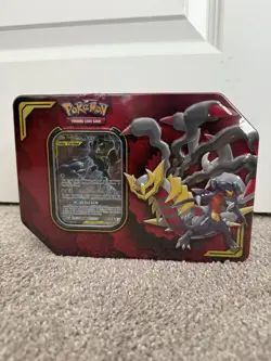 2019 POKEMON GARCHOMP & GIRATINA GX TAG TEAM TIN SEALED SMALL TEAR - Image 1