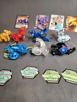 BAKUGAN lot of 7 with 4 cards - Image 1