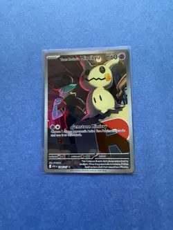 The Pokemon Company Pokemon TCG Team Rocket's Mimikyu 238/217 IR Holo Full Art - Image 1