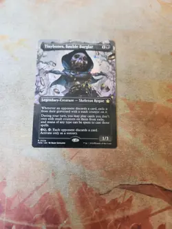 Tinybones, Bauble Burglar Borderless Foundations MTG NM - Image 1