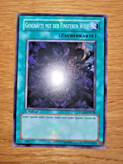 yugioh Geschaft mit der Finsteren Welt STON-DE038 super rare 1. Auflage Deutsch - Image 1
