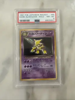 1997 POKEMON JPN ROCKET #65 DARK ALAKAZAM-HOLO PSA 8 - Image 1