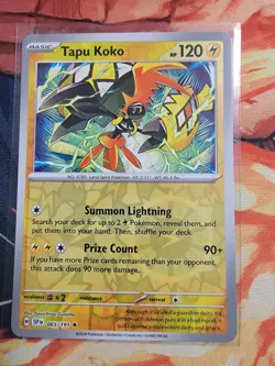Pokemon Card Surging Sparks Reverse Holo Tapu Koko 065/191 NM - Image 1