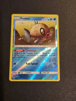REVERSE HOLO Pokemon Sun Moon Dragon Majesty Card Feebas 28/70 - Image 1