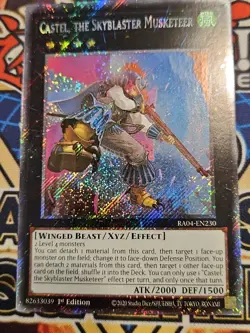 In Hand YUGIOH x1 RA04-EN230 CASTEL, THE SKYBLASTER MUSKETEER - PLATINUM SECRET - Image 1