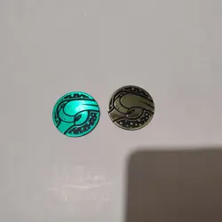 Pokemon TCG Flygon Plastic Coins Set Of 2 Gold & Green - Image 1