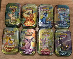 Pokemon TCG: Prismatic Evolutions - Set of 8 Mini Tins (Empty) Art Cards + Coins - Image 1
