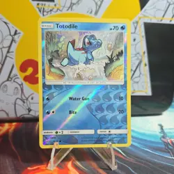 The Pokemon Company Pokemon TCG Totodile 18/73 Shining Legends Rev Holo EN 70HP - Image 1