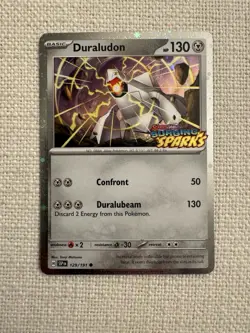 Duraludon 129/191 Surging Sparks Stamped Promo Cosmos Holo Pokemon TCG NM - Image 1