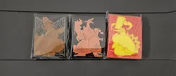 3 Pokemon ETB Sleeves (65ct) New And Sealed, Charizard, Eevee And Pikachu - Image 1