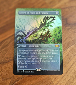 Sword of Feast and Famine - BORDERLESS FOIL - NM - MTG - Image 1