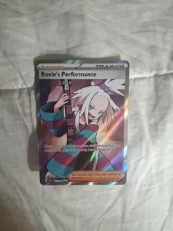 Pokemon Roxie's Performance 112/086 Me04: Chaos Rising Holo - Image 2