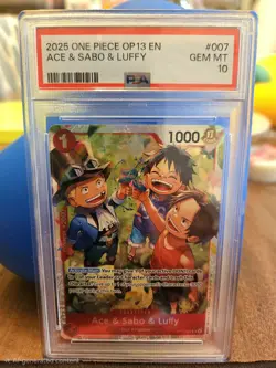 One Piece CCG PSA 10 Ace & Sabo & Luffy Foil OP13-007 2025 OP13 EN - Image 1