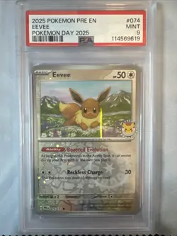 2025 Pokemon Day Prismatic Evolutions Eevee Reverse Holo PSA 9 Mint - Image 1