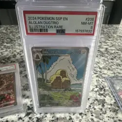 The Pokemon Company 2024 Sv08 Surging Sparks EN Alolan Dugtrio 208/191 PSA 8 - Image 1