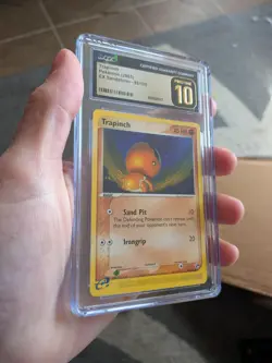 (POP 27) CGC 10 PRISTINE 2003 EX Sandstorm 82/100 Trapinch pokemon Card - Image 1