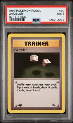 1999 POKEMON FOSSIL 1ST ED #60 GAMBLER PSA 9 - Image 1