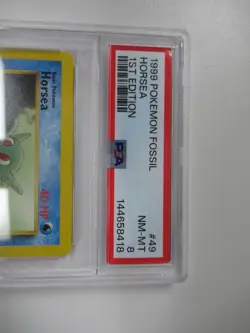 1999 Pokemon Fossil 1st Edition Horsea #49/62 PSA 8 - Image 2