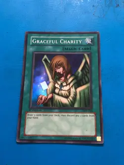 YUGIOH Super Rare Graceful Charity SDP-040 1st Edition PLAYED - Image 1
