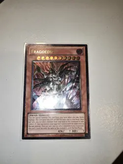 YUGIOH! TRAGOEDIA. TU04-EN000. ULTIMATE RARE. LIGHT PLAYED. - Image 1