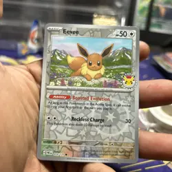 Eevee 74/131 Prismatic Evolutions 2025 Pokemon Day - NM - Image 1