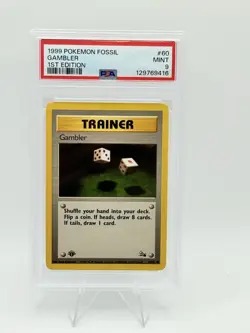 1999 POKEMON FOSSIL 1ST EDITION #60 GAMBLER PSA 9 - Image 1