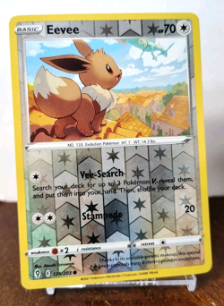 POKEMON EEVEE 125/203 REVERSE HOLO EVOLVING SKIES MP RAYQUAZA IN BACKGROUND - Image 1
