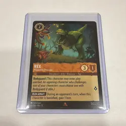 Ravensburger Disney Lorcana Rex, Protective Dinosaur Common Amber 10/204 EN - Image 1