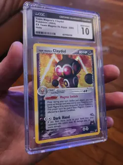 (TOP POP 27) CGC 10 GEM MINT Vs Aqua Pokemon Team Magma’s Claydol 8/95 Holo Card - Image 1
