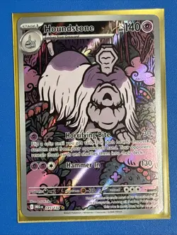 Houndstone 145/132 Mega Evolution Illustration Rare IR NM Holo + Card Saver - Image 1