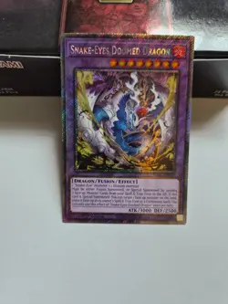 Yugioh Rarity 5 - Snake-Eyes Doomed Dragon (Platinum Secret Rare) - RA05-EN039 - Image 1