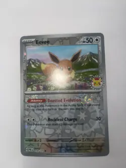 Eevee - 074/131 (Pokemon Day 2025) (Reverse Cosmos Holo) Prismatic Evolution - Image 3