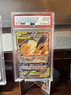 2019 POKEMON FA/EEVEE & SNORLAX GX TAG TEAM TINS BLACK STAR PROMO #SM169 PSA 10 - Image 1