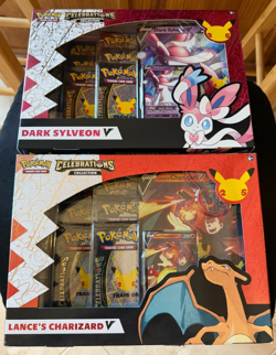 POKEMON CELEBRATIONS LANCE'S CHARIZARD V + DARK SYLVEON V COLLECTION BOXES - Image 1