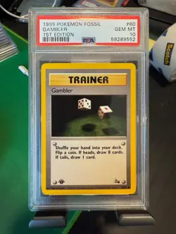 PSA 10 GEM MINT 1999 POKEMON FOSSIL 60 GAMBLER 1ST EDITION ENGLISH - Image 1