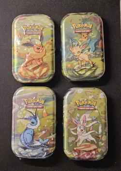Pokemon TCG Prismatic Evolutions Set of 4 Sealed Mini Tins - Image 1