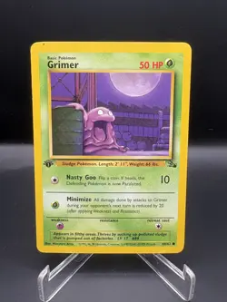Pokemon 1st Edition Grimer Common Fossil 48/62 LP - Image 1
