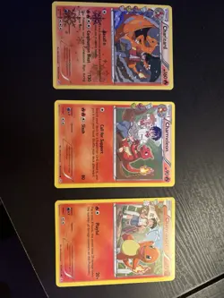 Pokemon 2016 Snowflake Pattern Charmander Charmeleon Charizard Card Lot (3) - Image 1